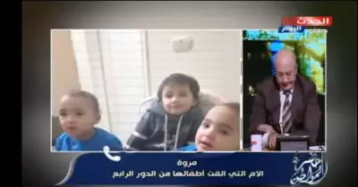 شاهد سيدة تلقي بأبنائها من الطابق الرابع بعد انلاع حريق بشقتها